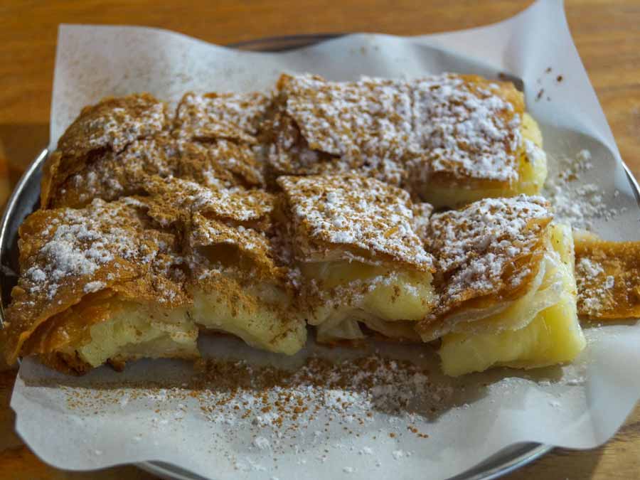 Mpougatsa with cream and cinnamon